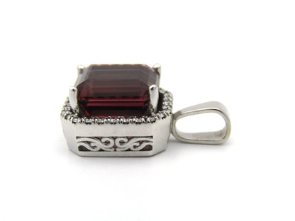 9K gold orange tourmaline and diamond ring.