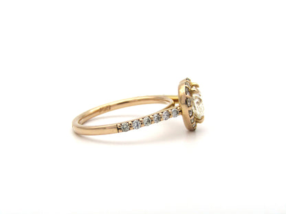 18K gold heart-shaped diamond halo ring.