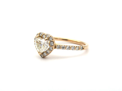18K gold heart-shaped diamond halo ring.