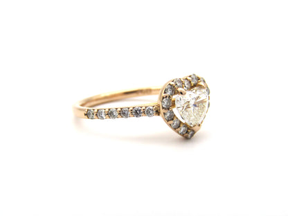 18K gold heart-shaped diamond halo ring.