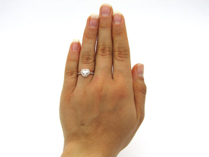 18K gold heart-shaped diamond halo ring.