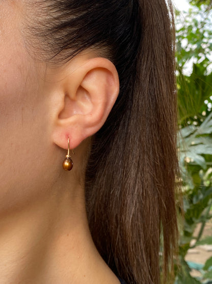 9K gold freshwater pearl dangle earrings.