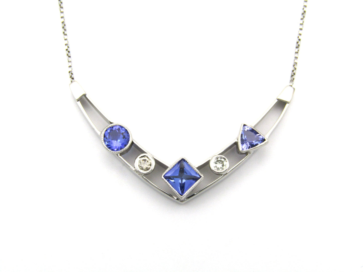 18K gold tanzanite and diamond necklace.