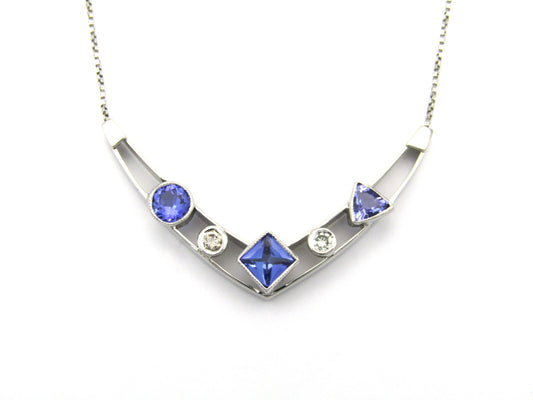 18K gold tanzanite and diamond necklace.