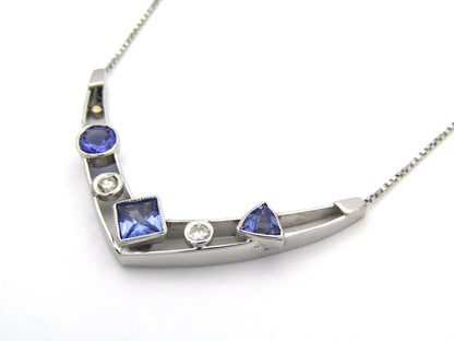 18K gold tanzanite and diamond necklace.