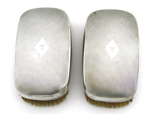 A pair of silver clothes brushes by Charles Packer & Co, London, 1929.