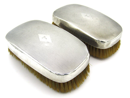 A pair of silver clothes brushes by Charles Packer & Co, London, 1929.