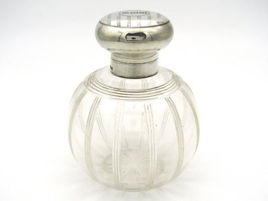 Silver-topped scent bottle by Mappin & Webb, London, 1915.