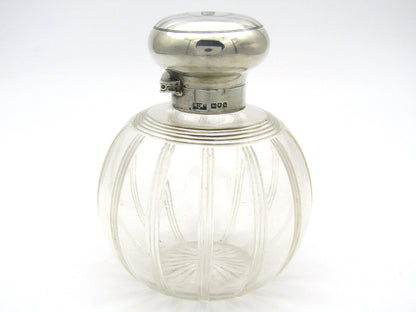 Silver-topped scent bottle by Mappin & Webb, London, 1915.