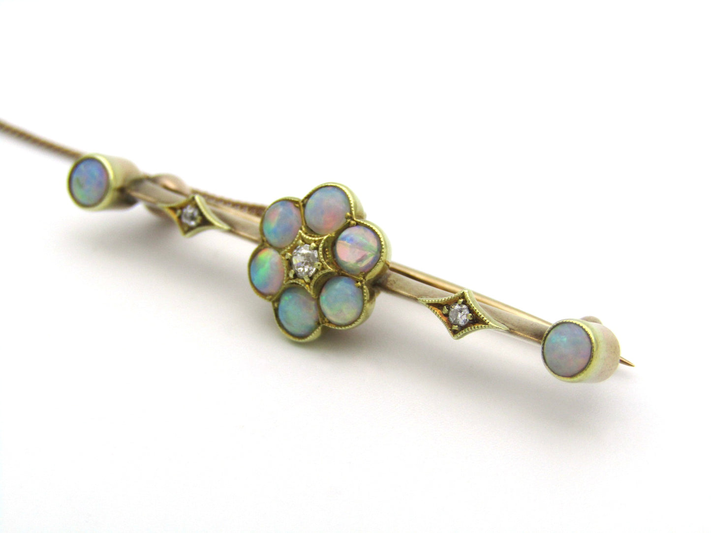 Edwardian 9K gold opal and diamond bar brooch, Circa 1905.