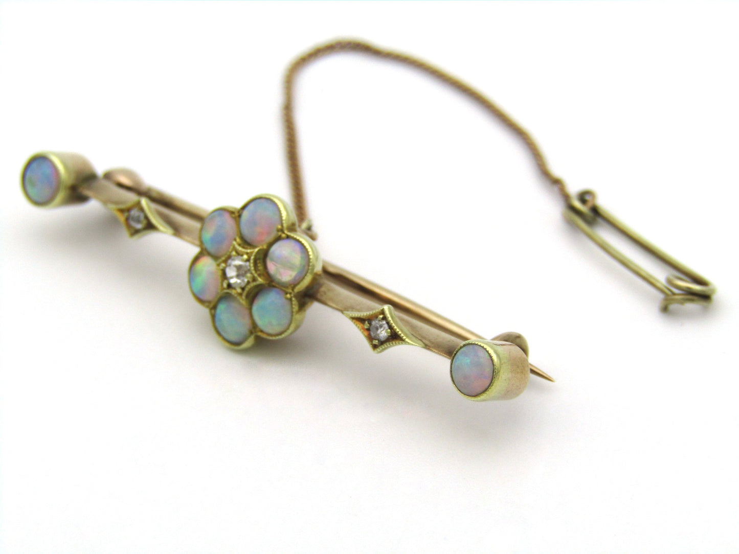 Edwardian 9K gold opal and diamond bar brooch, Circa 1905.