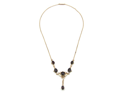 9K gold Edwardian garnet necklace, circa 1910.