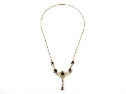 9K gold Edwardian garnet necklace, circa 1910.