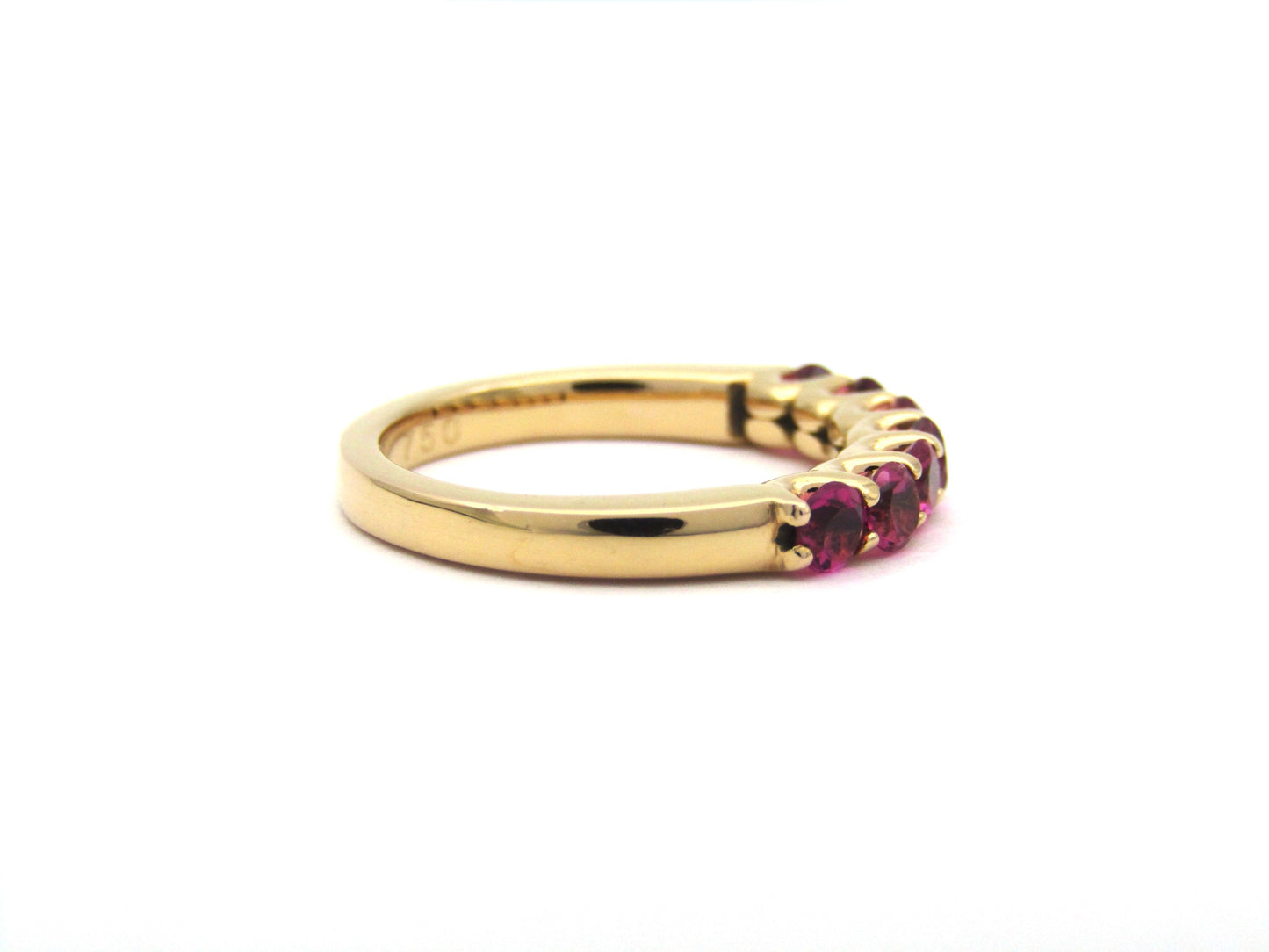 18K gold pink tourmaline half eternity ring.