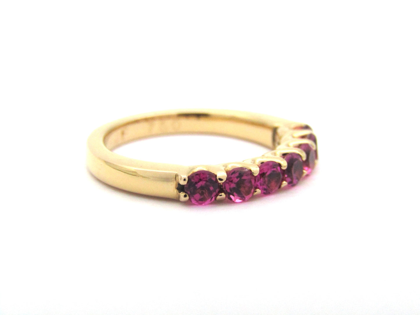 18K gold pink tourmaline half eternity ring.