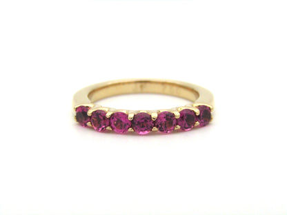 18K gold pink tourmaline half eternity ring.