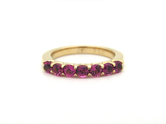 18K gold pink tourmaline half eternity ring.