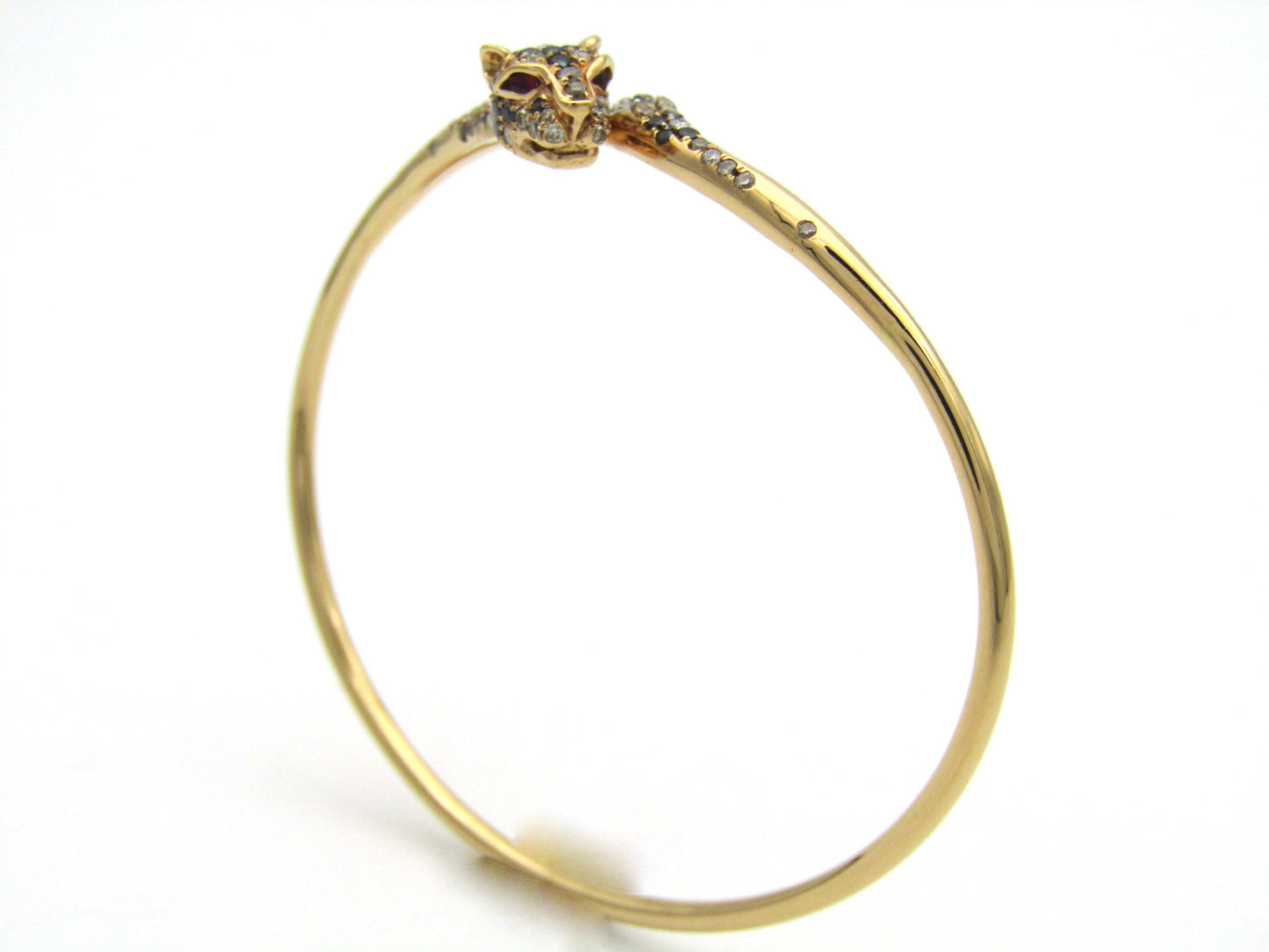 18K gold ruby and diamond leopard bangle.