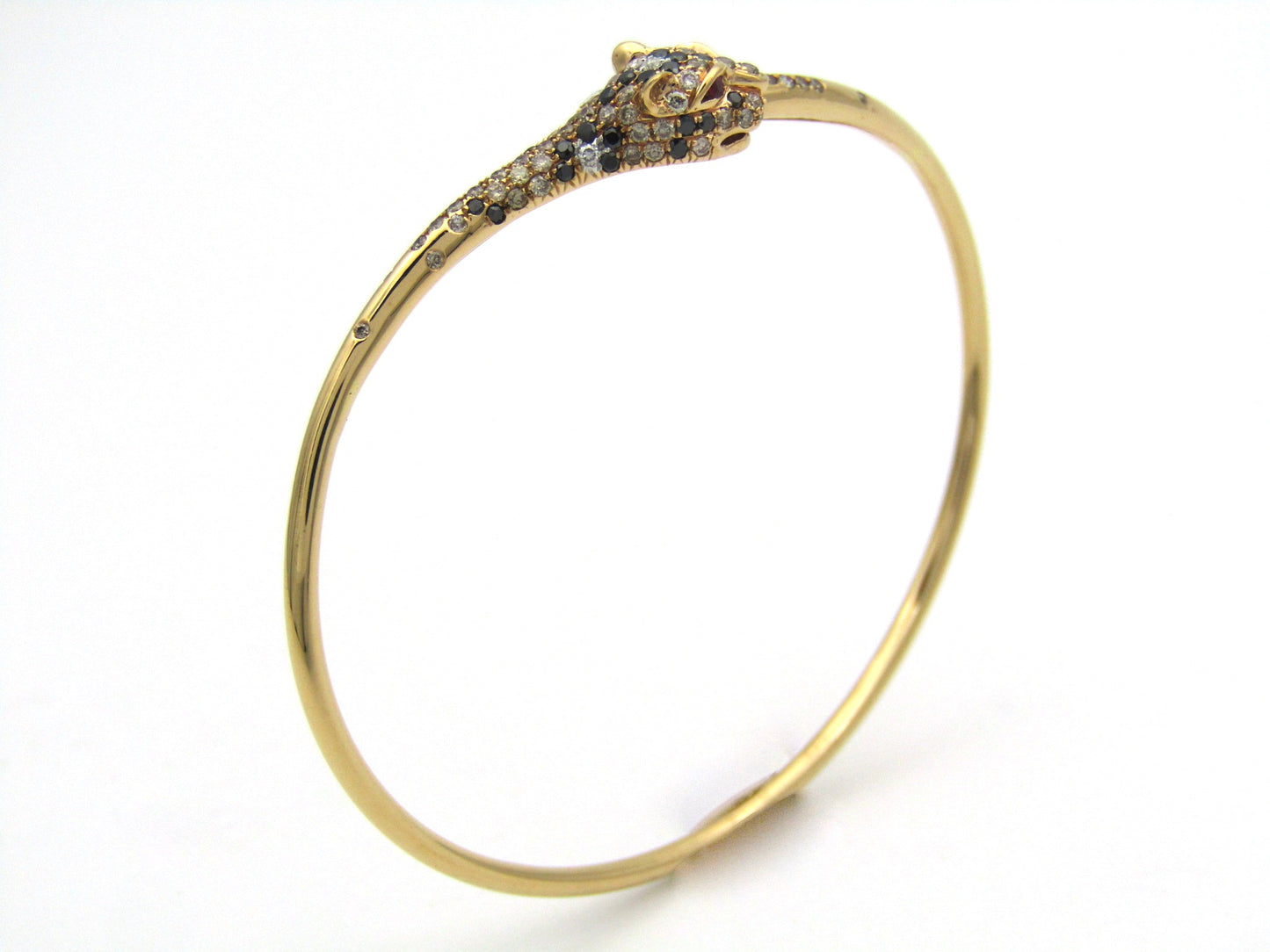 18K gold ruby and diamond leopard bangle.
