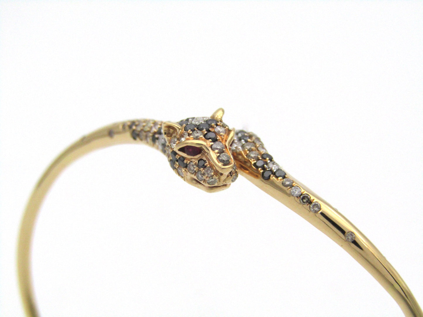 18K gold ruby and diamond leopard bangle.