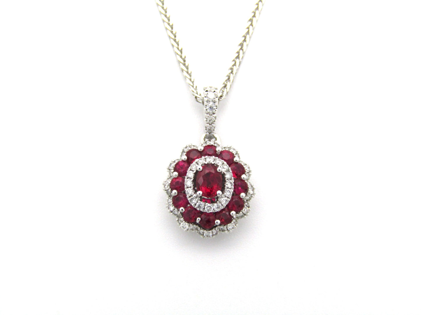 18K gold ruby and diamond pendant.