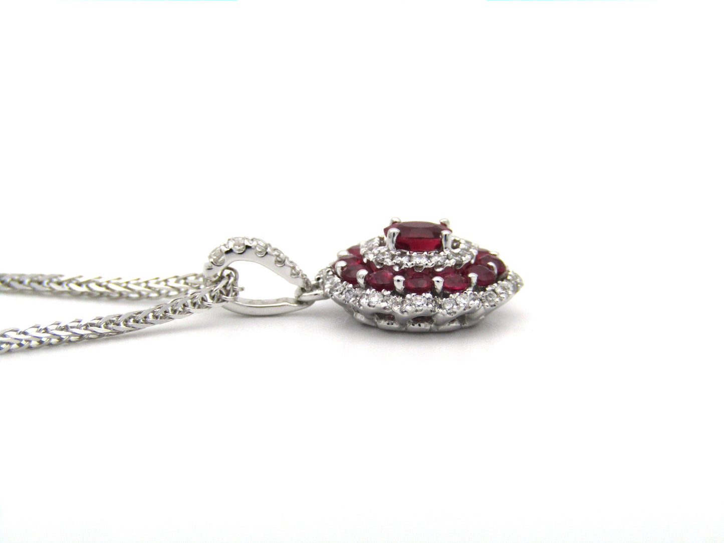 18K gold ruby and diamond pendant.