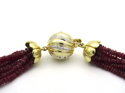 14K gold diamond and 7-strand ruby necklace.