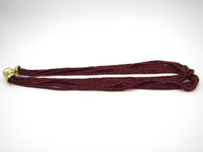 14K gold diamond and 7-strand ruby necklace.