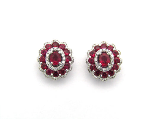18K gold ruby and diamond earrings.