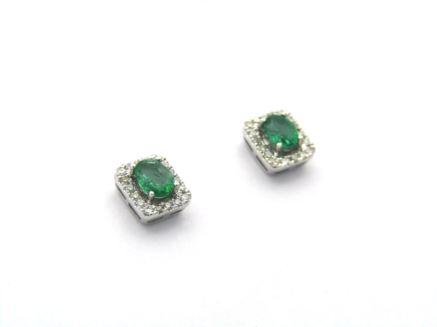 9K gold emerald and diamond earrings.