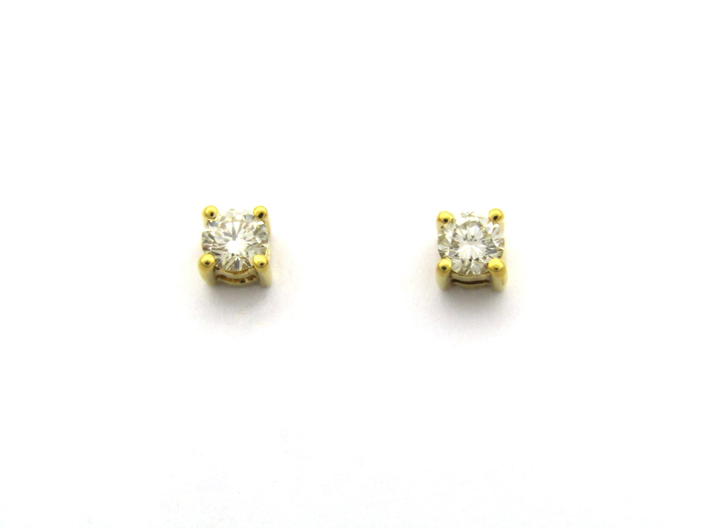 18K gold diamond stud earrings.