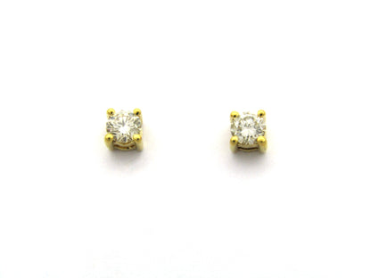 18K gold diamond stud earrings.
