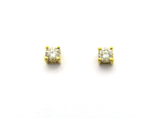 18K gold diamond stud earrings.