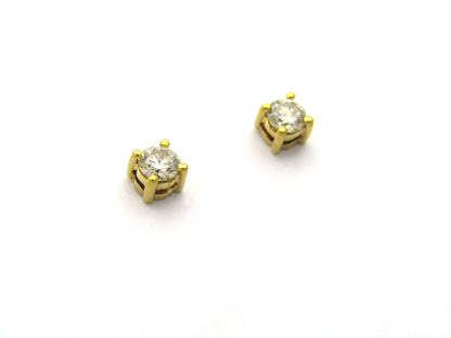 18K gold diamond stud earrings.