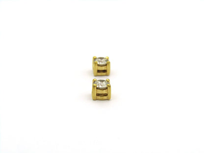 18K gold diamond stud earrings.