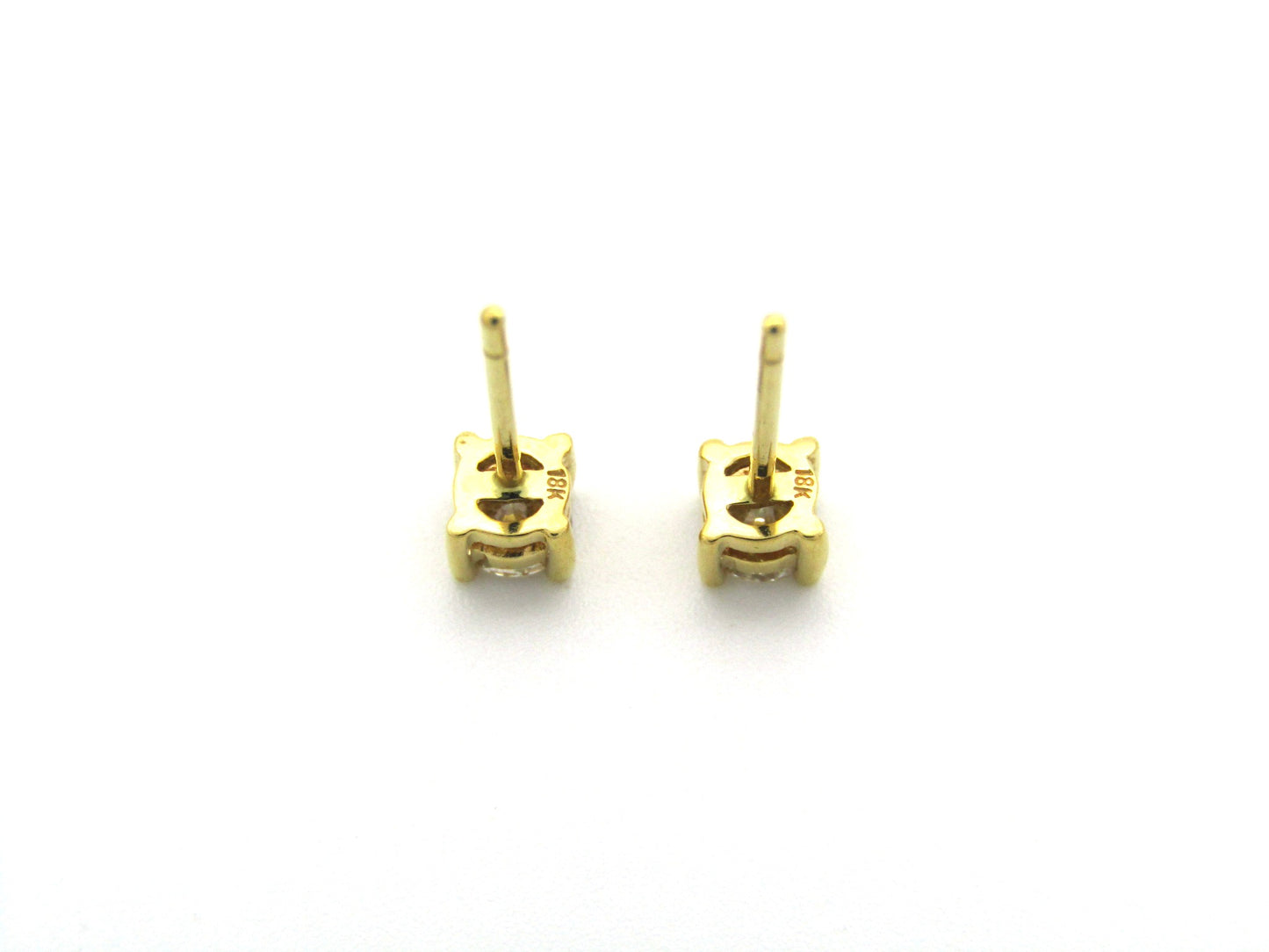 18K gold diamond stud earrings.