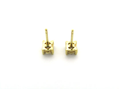 18K gold diamond stud earrings.