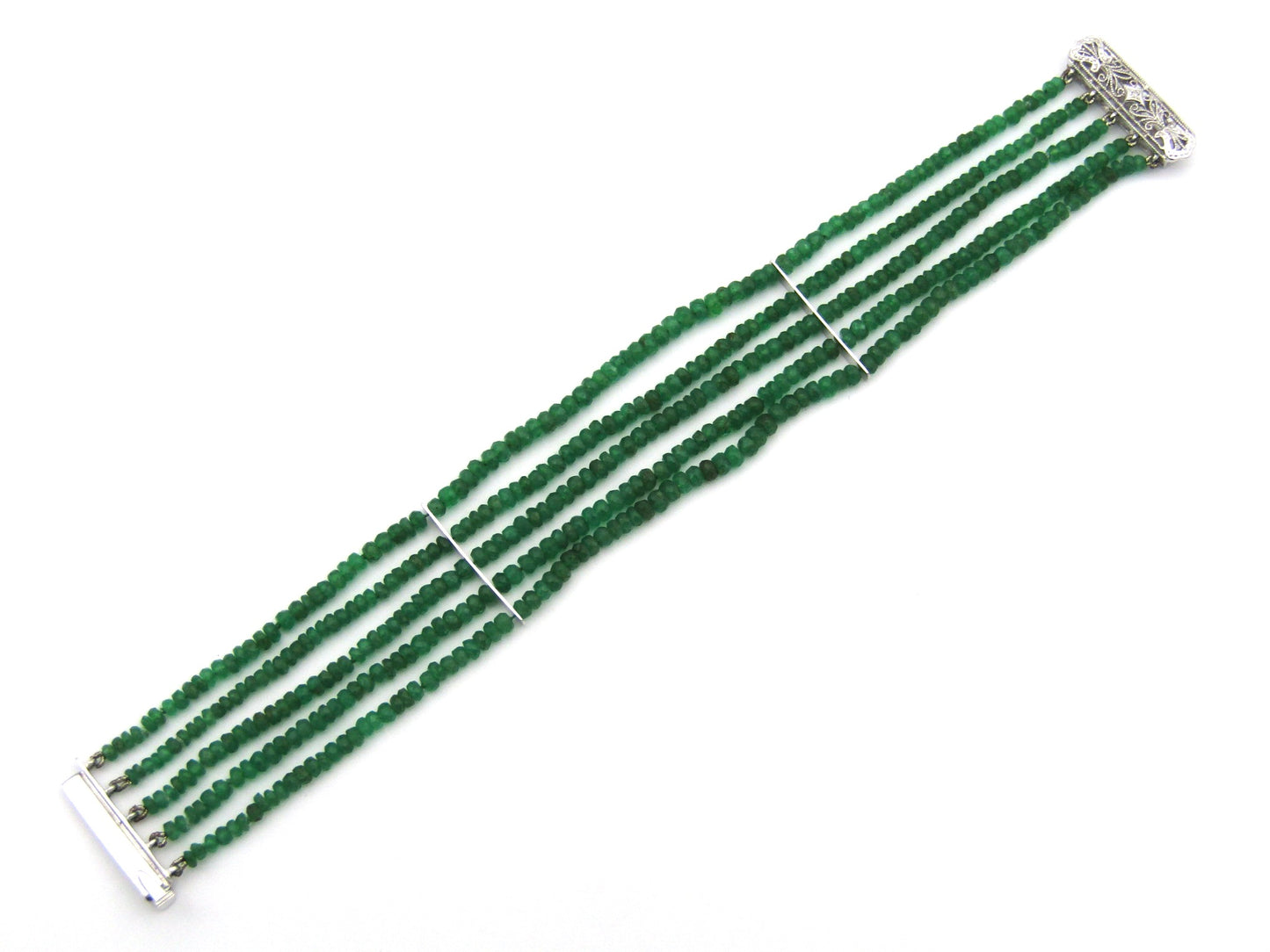14K gold diamond and 5 strand emerald bracelet.