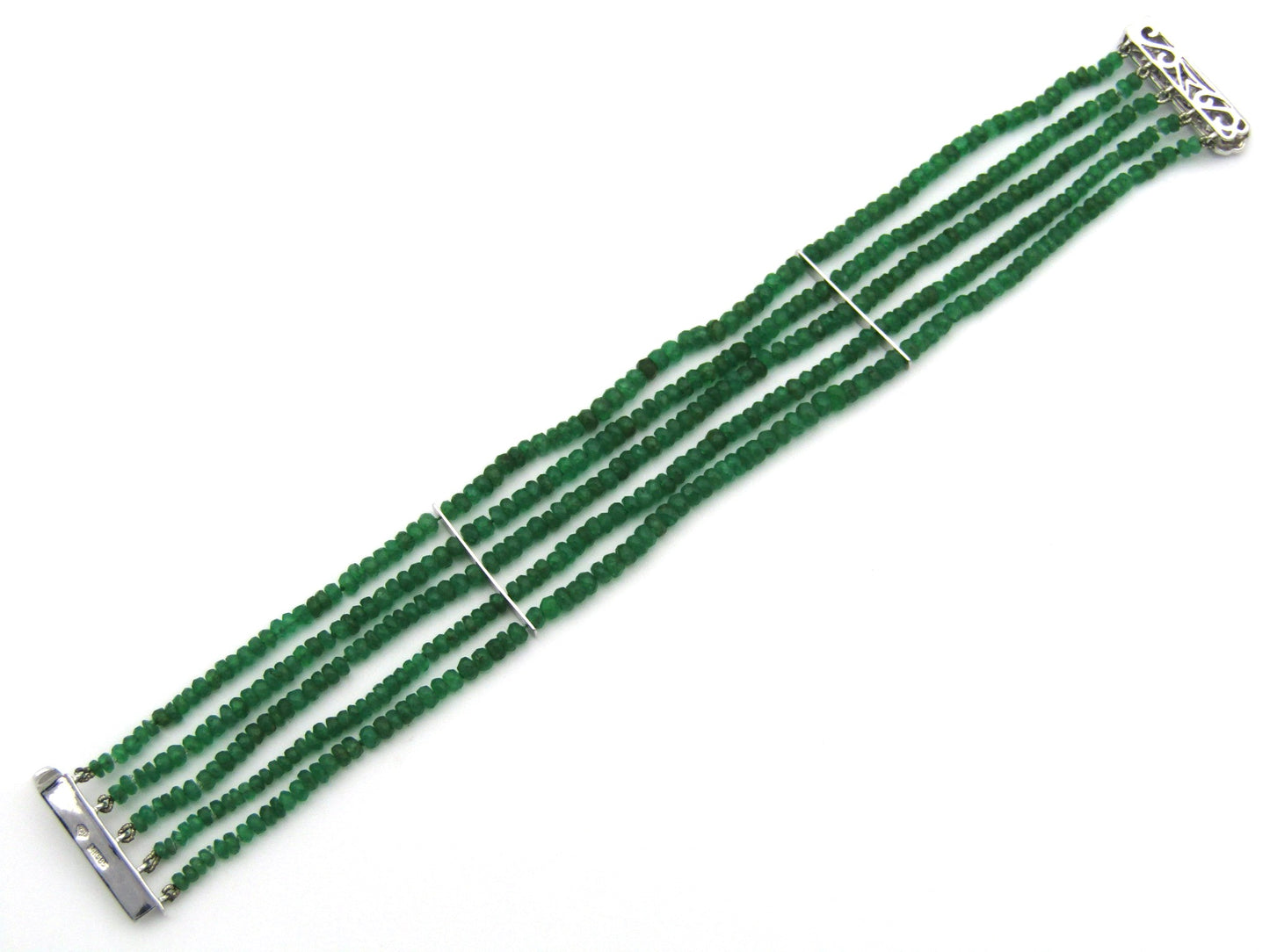 14K gold diamond and 5 strand emerald bracelet.