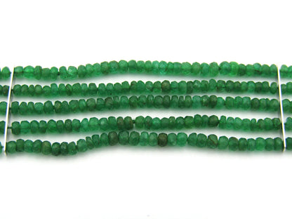 14K gold diamond and 5 strand emerald bracelet.