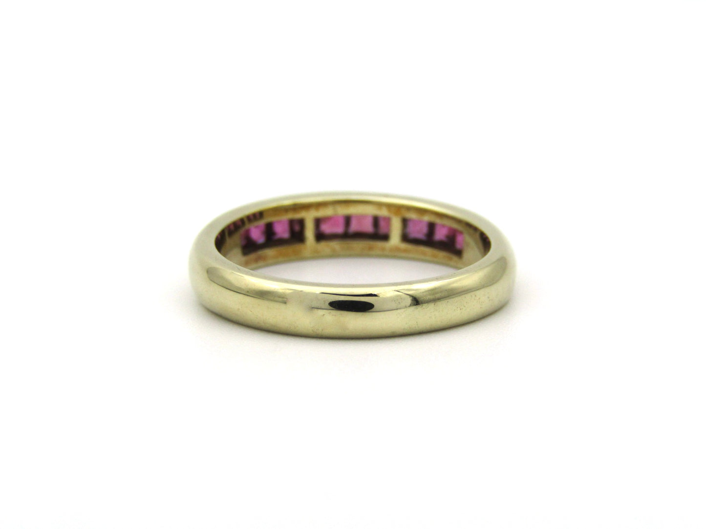 9K gold rhodolite garnet half eternity ring.