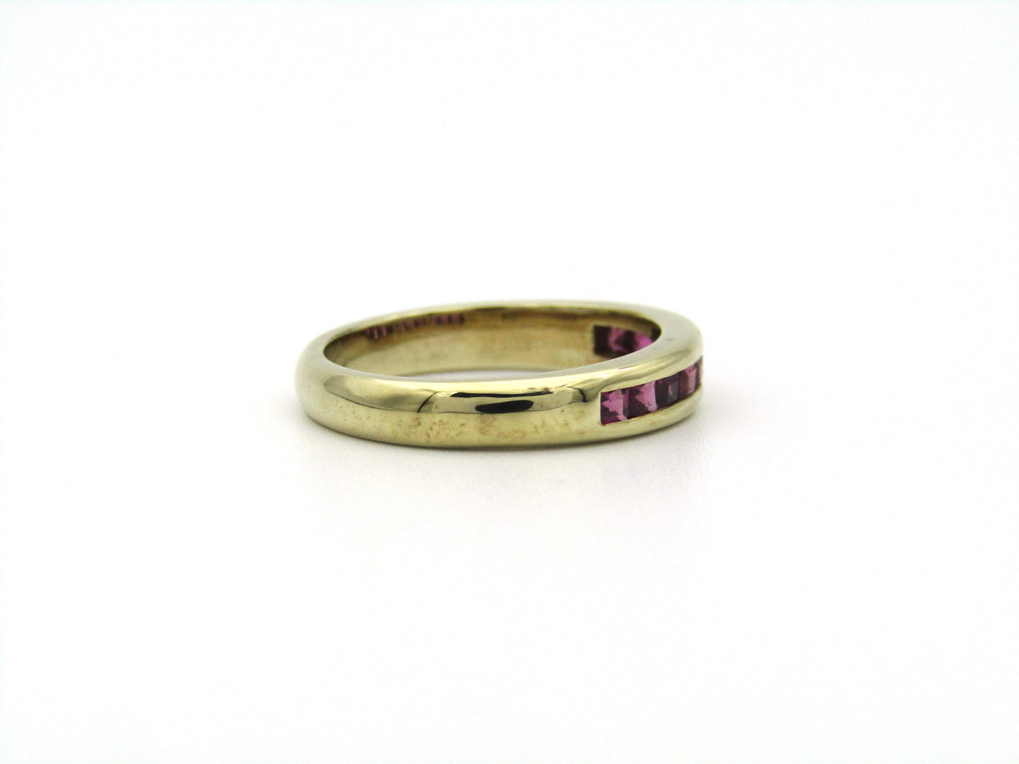 9K gold rhodolite garnet half eternity ring.