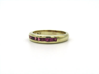 9K gold rhodolite garnet half eternity ring.
