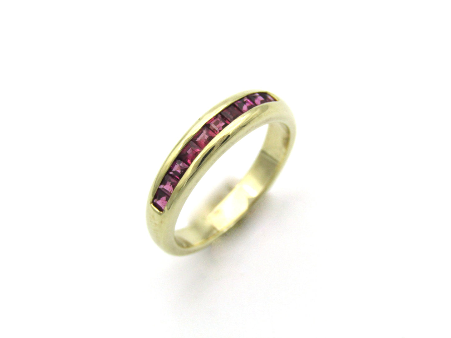 9K gold rhodolite garnet half eternity ring.