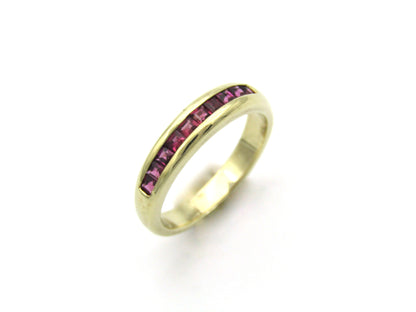 9K gold rhodolite garnet half eternity ring.