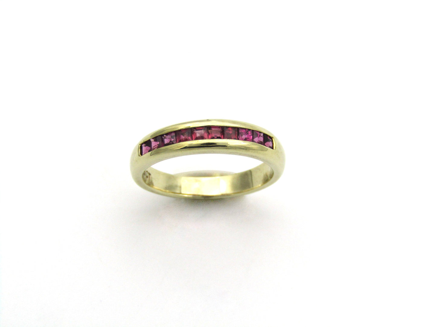 9K gold rhodolite garnet half eternity ring.
