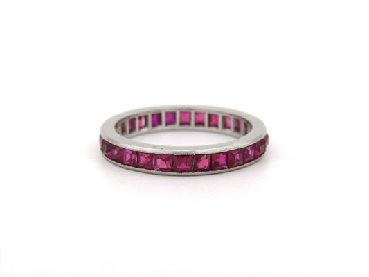 Platinum synthetic ruby eternity ring, circa 1990's.