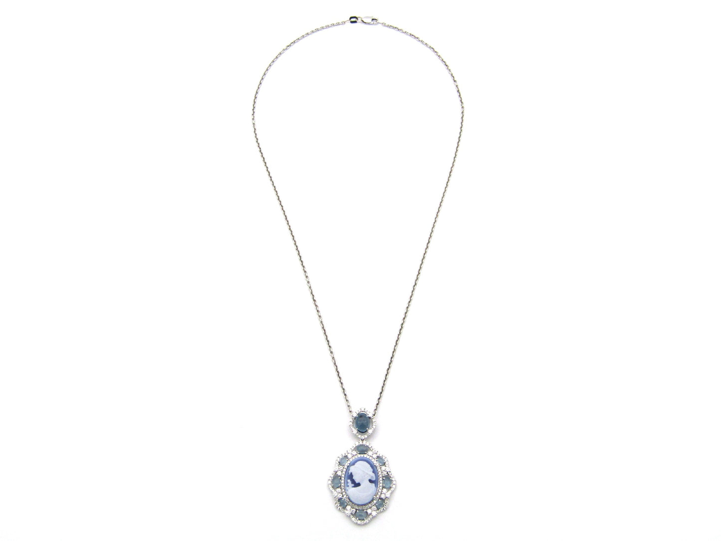 18K gold agate cameo, blue topaz and diamond pendant.