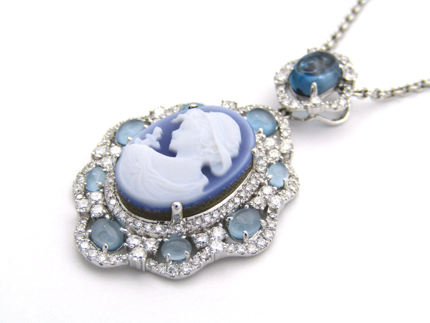18K gold agate cameo, blue topaz and diamond pendant.