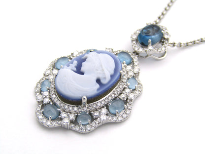 18K gold agate cameo, blue topaz and diamond pendant.